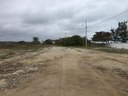 Road to the lot.  Lot is to left; ocean cliff is to right