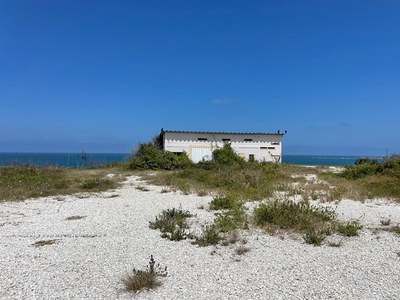 Oceanfront land on cliff with house.jpg