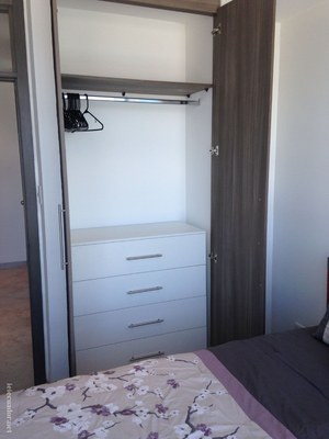 Bedroom Closet with Built in Drawers