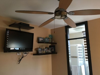  Master Bedroom With TV And Ceiling Fan. 