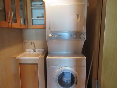 Laundry Room With Stackable Washer Dryer And Utility Sink 