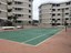 View Down Tennis Court Toward Building