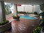 Second Covered Pool Area With Lush Greenery