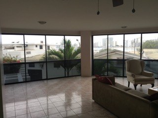 Living Area Has Two Walls Of Windows With Ocean View