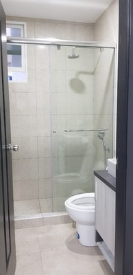 Bathroom With Glass-Enclosed Shower