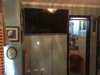 Television And Door To Private Master Bathroom