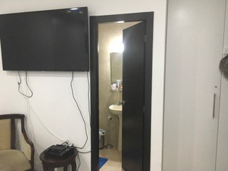 Television And Entrance To Master Bathroom