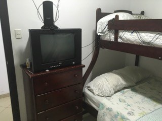 Television And Dresser In Second Bedroom