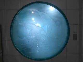 Round Window With Dolphin Design