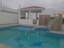 Pool, Hot Tub, And BBQ Area At Mikonos