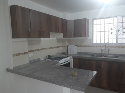 Modern Upper And Lower Cabinets And Granite Counter Tops In Kitchen
