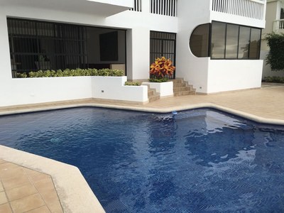 Looking Over The Pool Toward Covered Patio Area