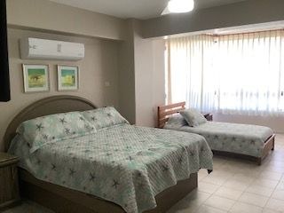 Spacious master bedroom with air conditioner.jpg