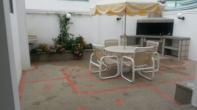  Outdoor courtyard with seating and BBQ.jpg