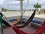 Built-In Seating And Hammocks On Front Porch
