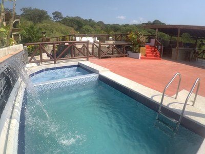 View From Pool Toward Covered BBQ Area