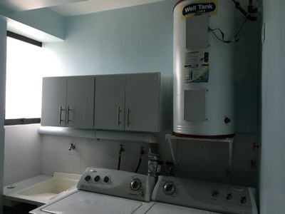   Hot Water Tank And Additional Cabinets. 