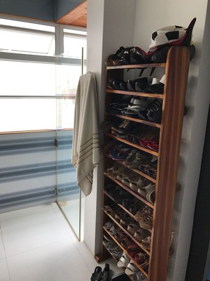 Shoe Rack next to Open Shower
