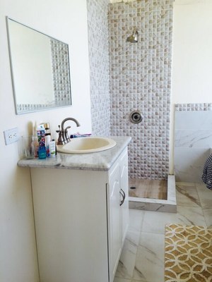 Vanity And Shower In Master Bathroom