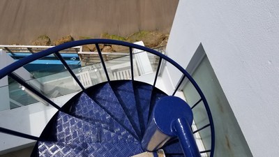  View Down Spiral Staircase From Private Terrace.