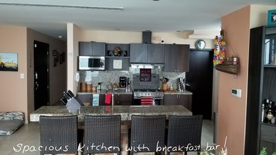 Spacious Kitchen With Breakfast Bar.