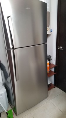 Extra Refrigerator In Laundry Room.