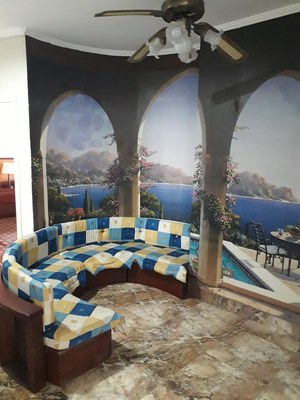 Sitting Area With Scenic Wallpaper
