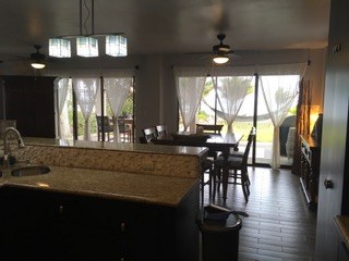 Kitchen View Of Dining Area And Terrace Beyond