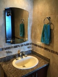 Vanity Mirror And Beautiful Tile In Guest Bathroom