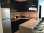   Rich Dark Wood Cabinetry In Kitchen.jpg