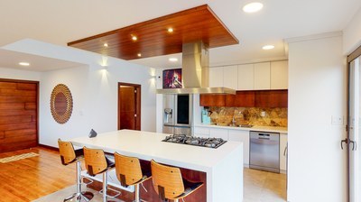 Kitchen island with chairs and built-in stove