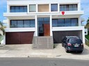 Curb Side view of 3 level Duplex on the Sunny Sea View of sun rise & sun set!