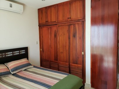 Master bedroom with hardwood closets